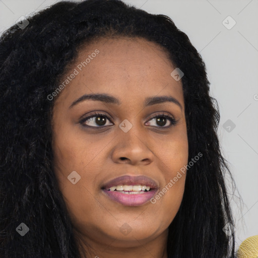 Joyful black young-adult female with long  brown hair and brown eyes