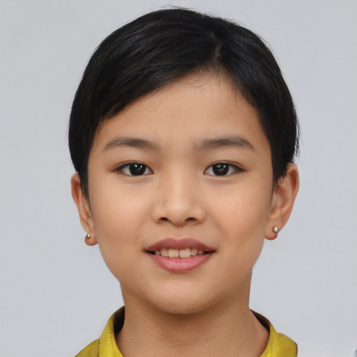Joyful asian child female with short  brown hair and brown eyes