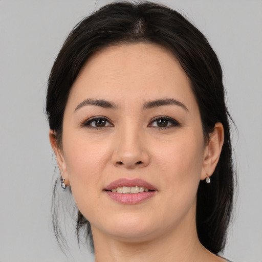 Joyful asian young-adult female with medium  brown hair and brown eyes