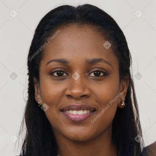 Joyful black young-adult female with long  black hair and brown eyes