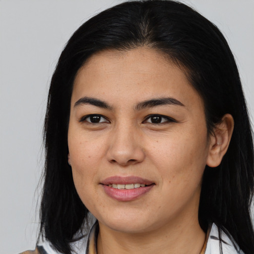 Joyful asian young-adult female with medium  brown hair and brown eyes