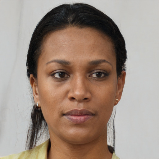 Neutral black young-adult female with short  brown hair and brown eyes