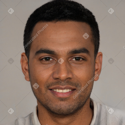 Joyful black young-adult male with short  black hair and brown eyes