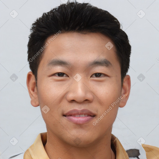 Joyful asian young-adult male with short  black hair and brown eyes