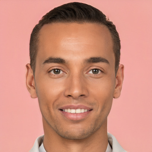 Joyful white young-adult male with short  black hair and brown eyes