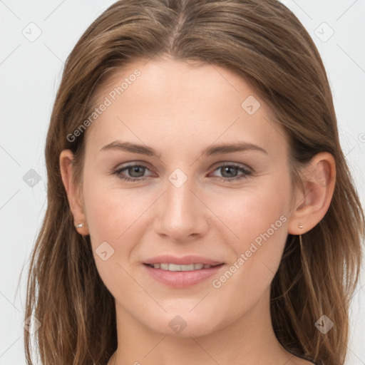 Joyful white young-adult female with long  brown hair and grey eyes