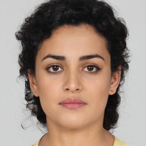 Neutral latino young-adult female with medium  black hair and brown eyes