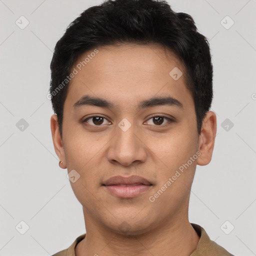 Joyful latino young-adult male with short  black hair and brown eyes