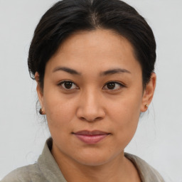 Joyful asian young-adult female with short  brown hair and brown eyes