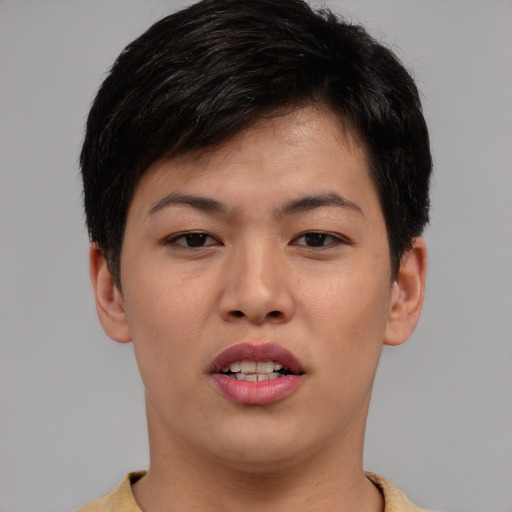 Joyful asian young-adult female with short  brown hair and brown eyes