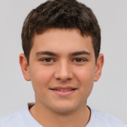 Joyful white child male with short  brown hair and brown eyes