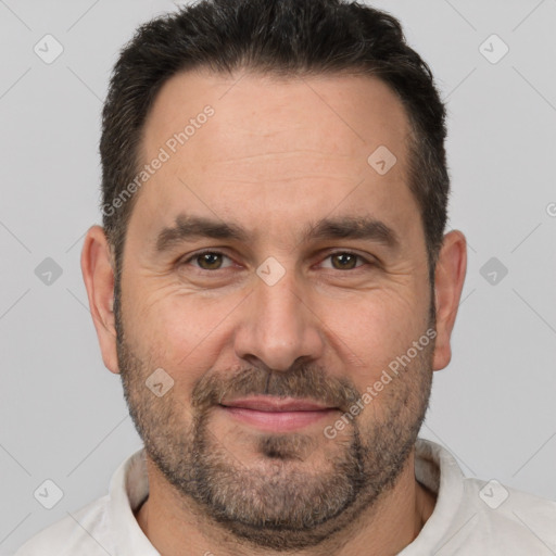 Joyful white adult male with short  brown hair and brown eyes