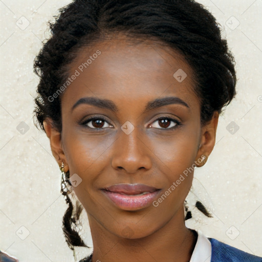 Joyful black young-adult female with long  brown hair and brown eyes