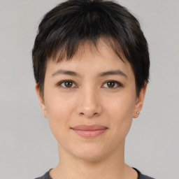 Joyful asian young-adult female with short  brown hair and brown eyes