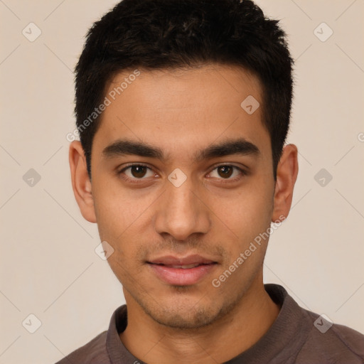 Joyful latino young-adult male with short  black hair and brown eyes