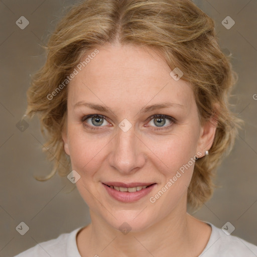 Joyful white adult female with medium  brown hair and green eyes