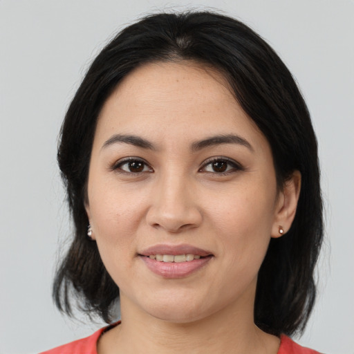 Joyful asian young-adult female with medium  brown hair and brown eyes