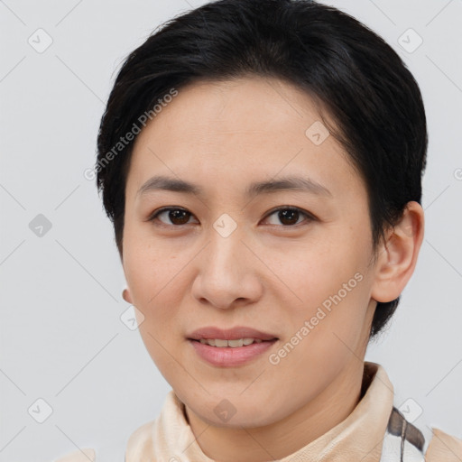 Joyful asian young-adult female with short  brown hair and brown eyes