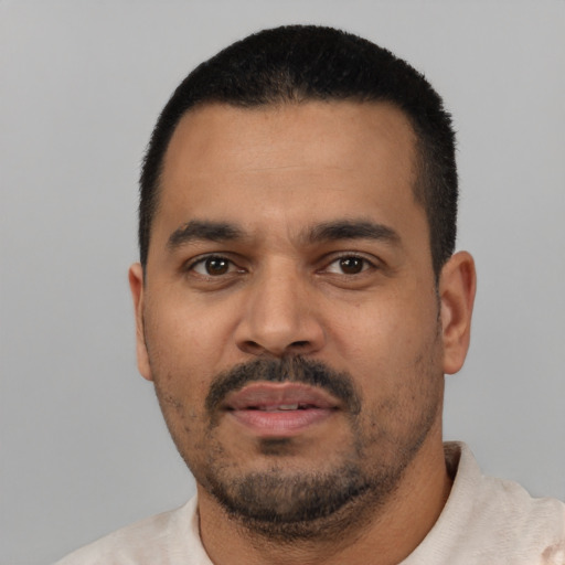 Neutral latino young-adult male with short  black hair and brown eyes