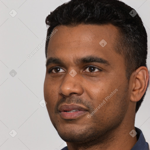 Neutral latino young-adult male with short  black hair and brown eyes