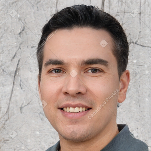 Joyful white young-adult male with short  black hair and brown eyes