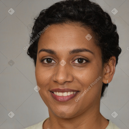 Joyful latino young-adult female with short  brown hair and brown eyes