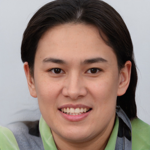 Joyful white young-adult female with medium  brown hair and brown eyes