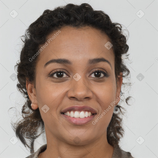 Joyful black young-adult female with medium  brown hair and brown eyes