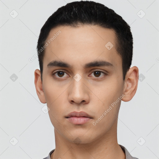 Neutral latino young-adult male with short  black hair and brown eyes