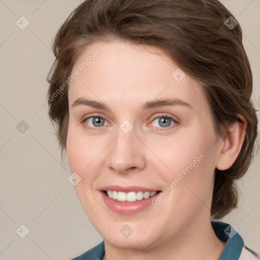 Joyful white young-adult female with medium  brown hair and blue eyes