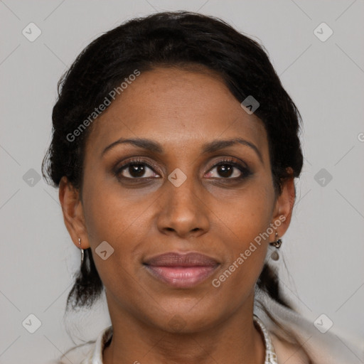 Joyful black adult female with medium  brown hair and brown eyes