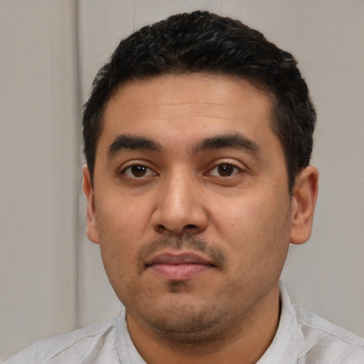 Neutral latino young-adult male with short  black hair and brown eyes