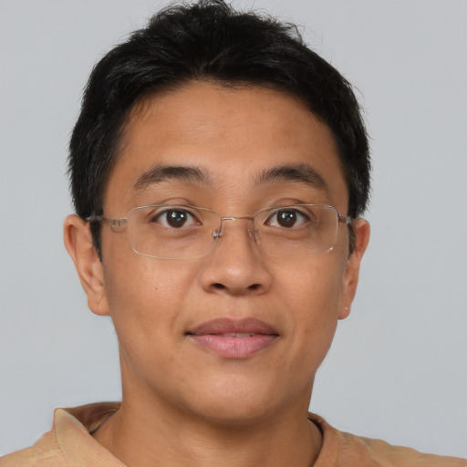 Joyful asian young-adult male with short  brown hair and brown eyes