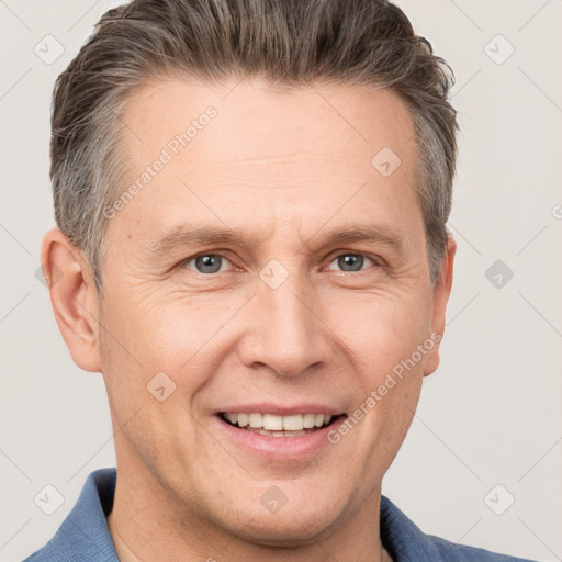 Joyful white adult male with short  brown hair and grey eyes