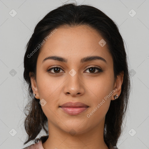 Joyful latino young-adult female with medium  brown hair and brown eyes