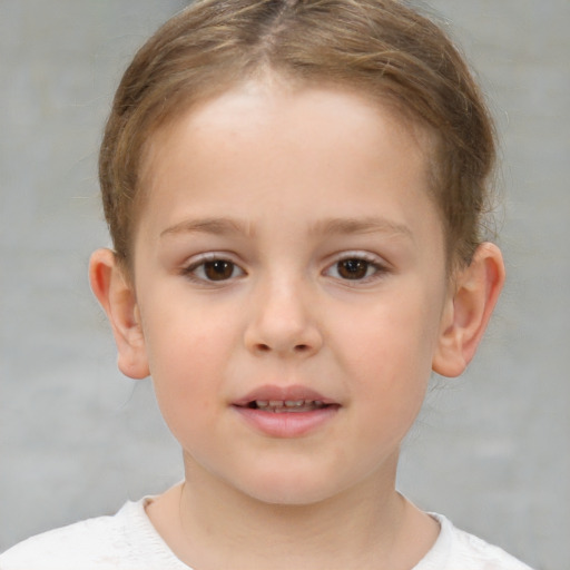 Joyful white child female with short  brown hair and brown eyes