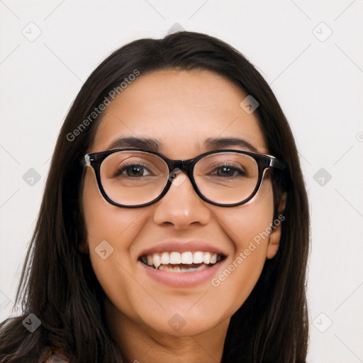 Joyful latino young-adult female with long  black hair and brown eyes