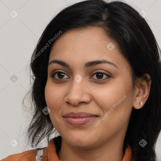 Joyful latino young-adult female with long  brown hair and brown eyes