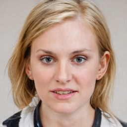 Joyful white young-adult female with medium  brown hair and blue eyes