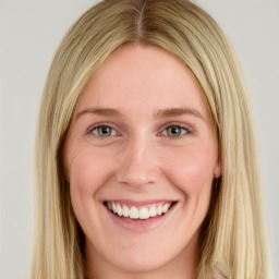 Joyful white young-adult female with long  brown hair and blue eyes