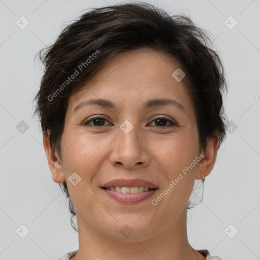 Joyful white adult female with short  brown hair and brown eyes