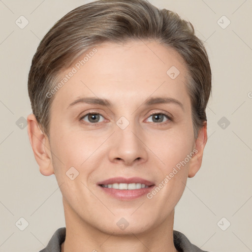 Joyful white young-adult female with short  brown hair and grey eyes