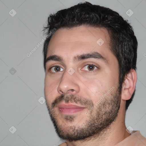 Joyful white young-adult male with short  black hair and brown eyes