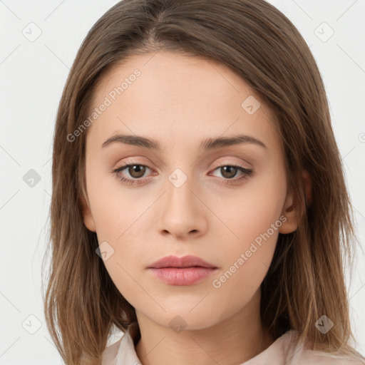 Neutral white young-adult female with long  brown hair and brown eyes