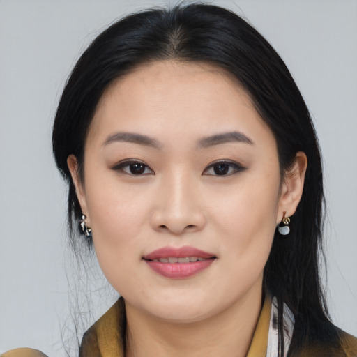 Joyful asian young-adult female with medium  black hair and brown eyes