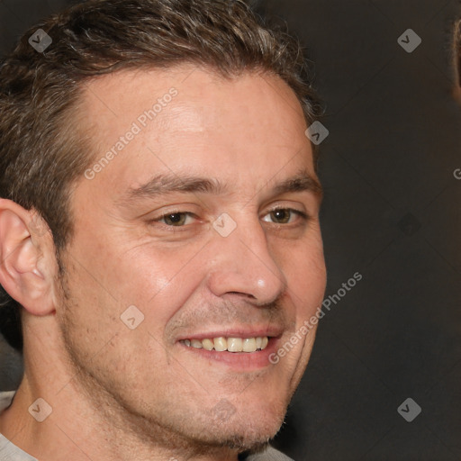 Joyful white adult male with short  brown hair and grey eyes