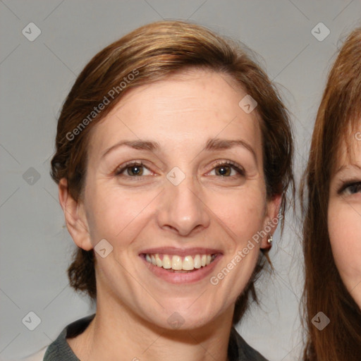 Joyful white adult female with medium  brown hair and brown eyes