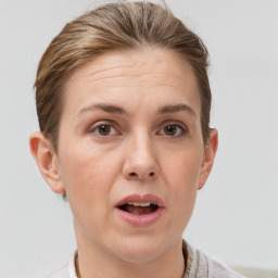 Joyful white adult female with short  brown hair and brown eyes