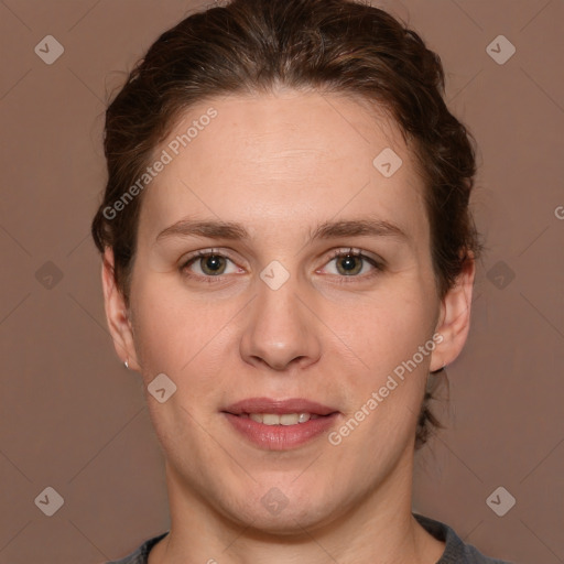 Joyful white adult female with short  brown hair and brown eyes