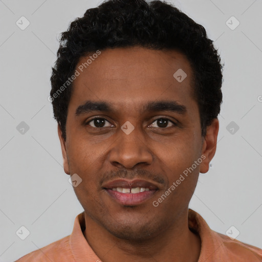 Joyful black young-adult male with short  black hair and brown eyes